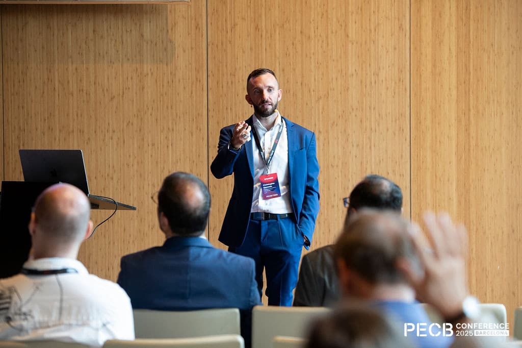 Christophe Mazzola speaking at the PECB Conference 2025